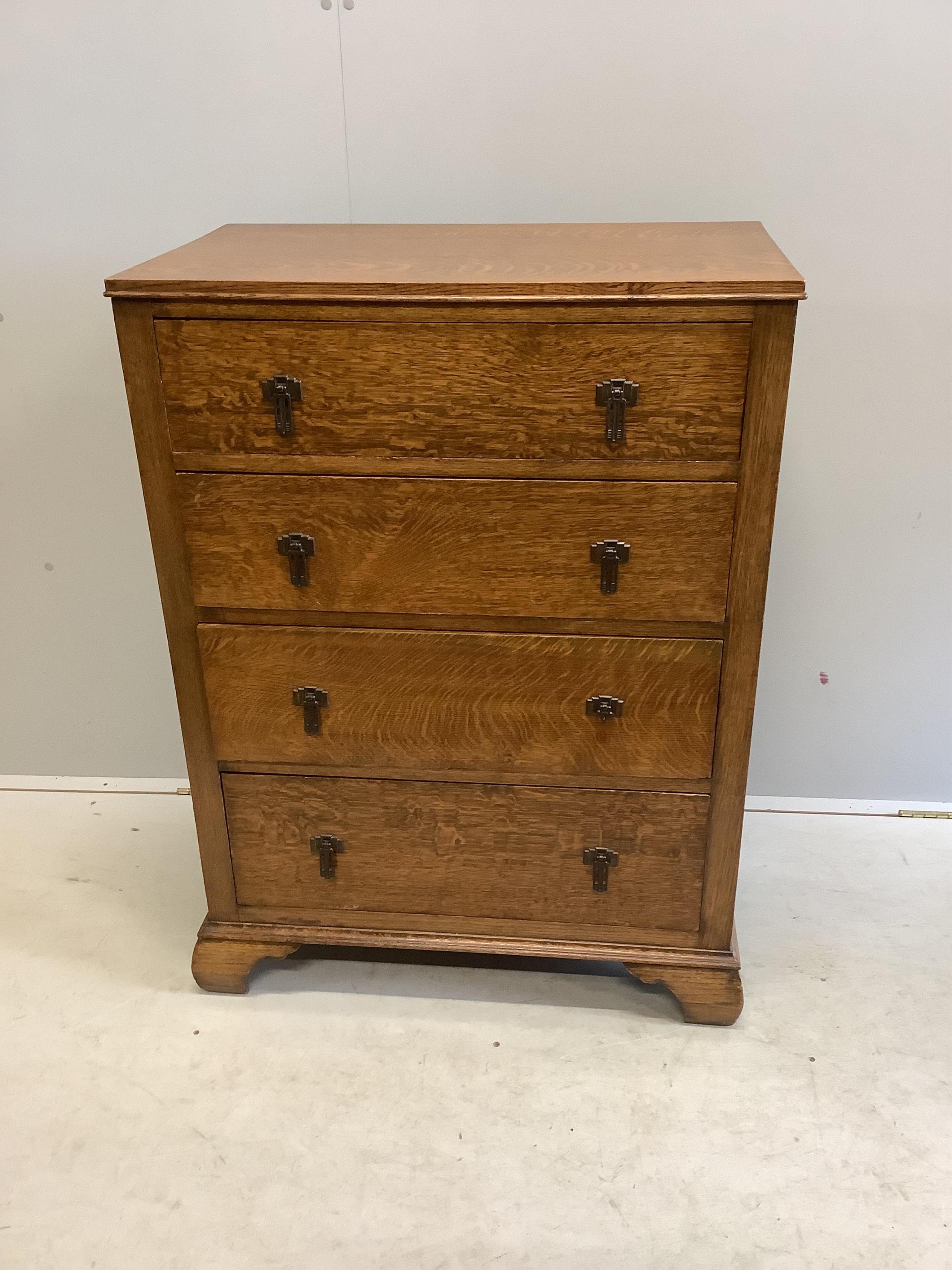 An early 20th century oak chest of four drawers, width 76cm, depth 46cm, height 104cm. Condition - good, one metal handle broken but piece is present